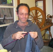 Francis Dwyer is knitting a blue baby sweater for his nephew. “My friend Rowing Crow instructed me four years ago.”