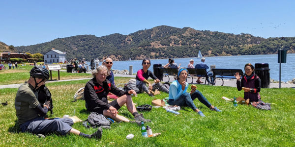 Group picnicking on lawn